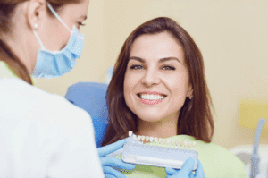 Patient smiling after dental veneers in Ealing at Stunning Smile Clinic, showing a natural, bright, confident smile

