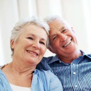 Smiling patient after receiving dental implants in Ealing at Stunning Smile Clinic

